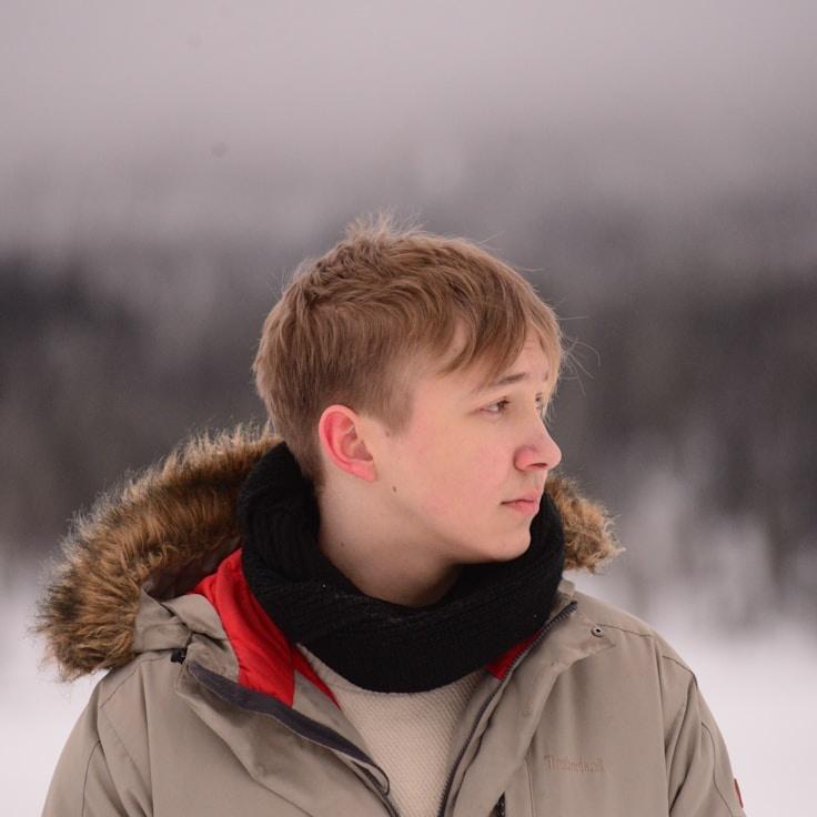 Avery Chen, Lead Design Curator at TinyStreamFind, reviewing corporate floral arrangements